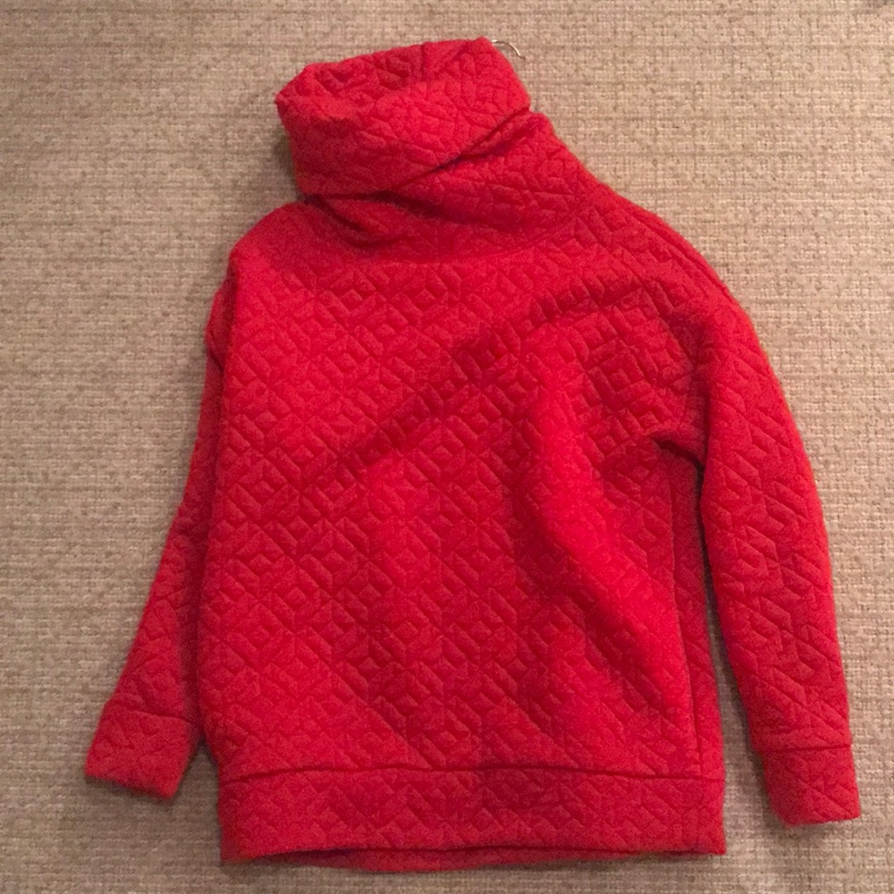 Bright red turtle neck sweater